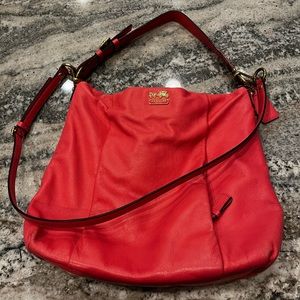 Coach leather hobo purse with shoulder and crossbody straps.